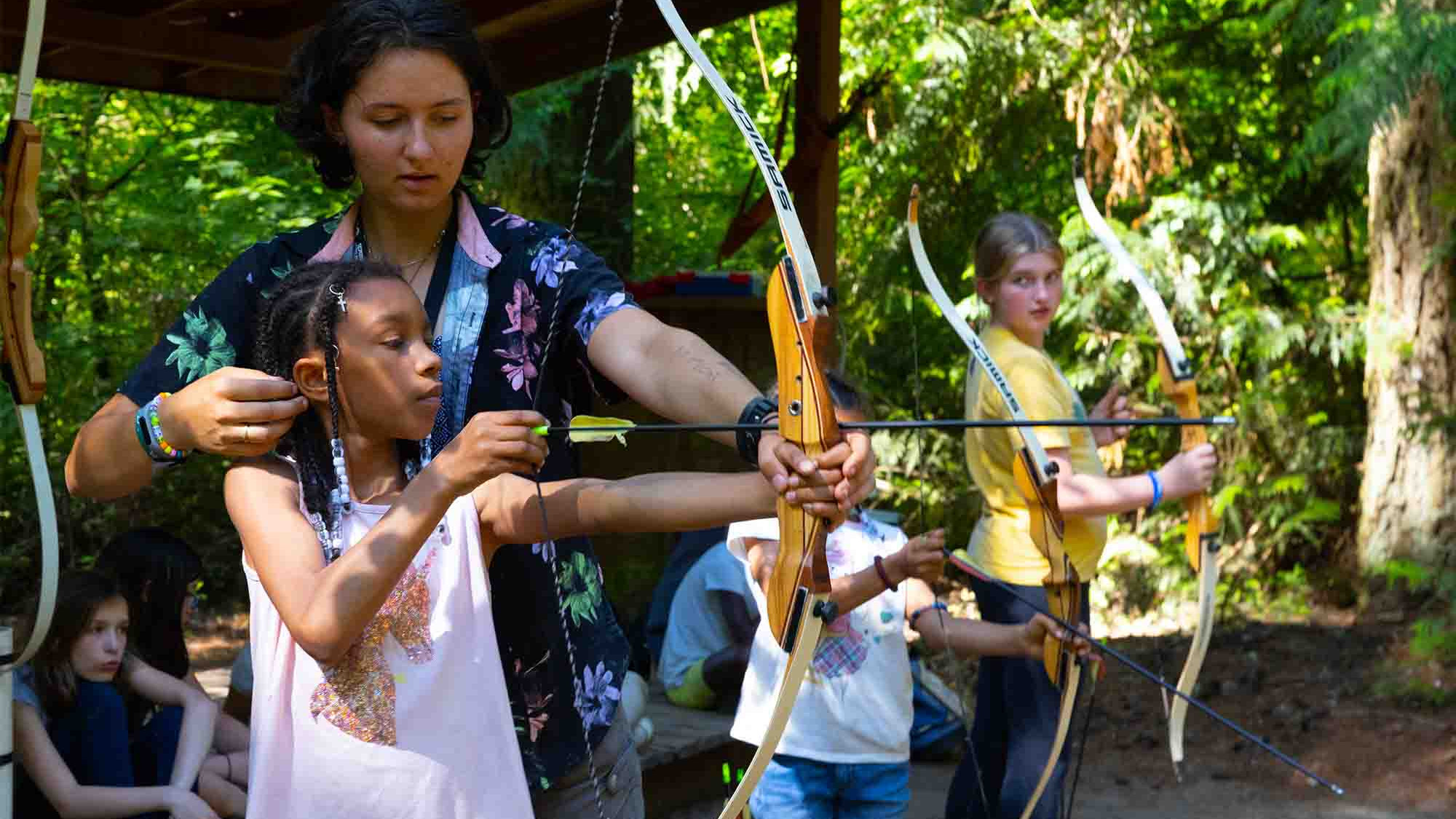 CRISTA Camps Activities - Young Girl Learning Archery